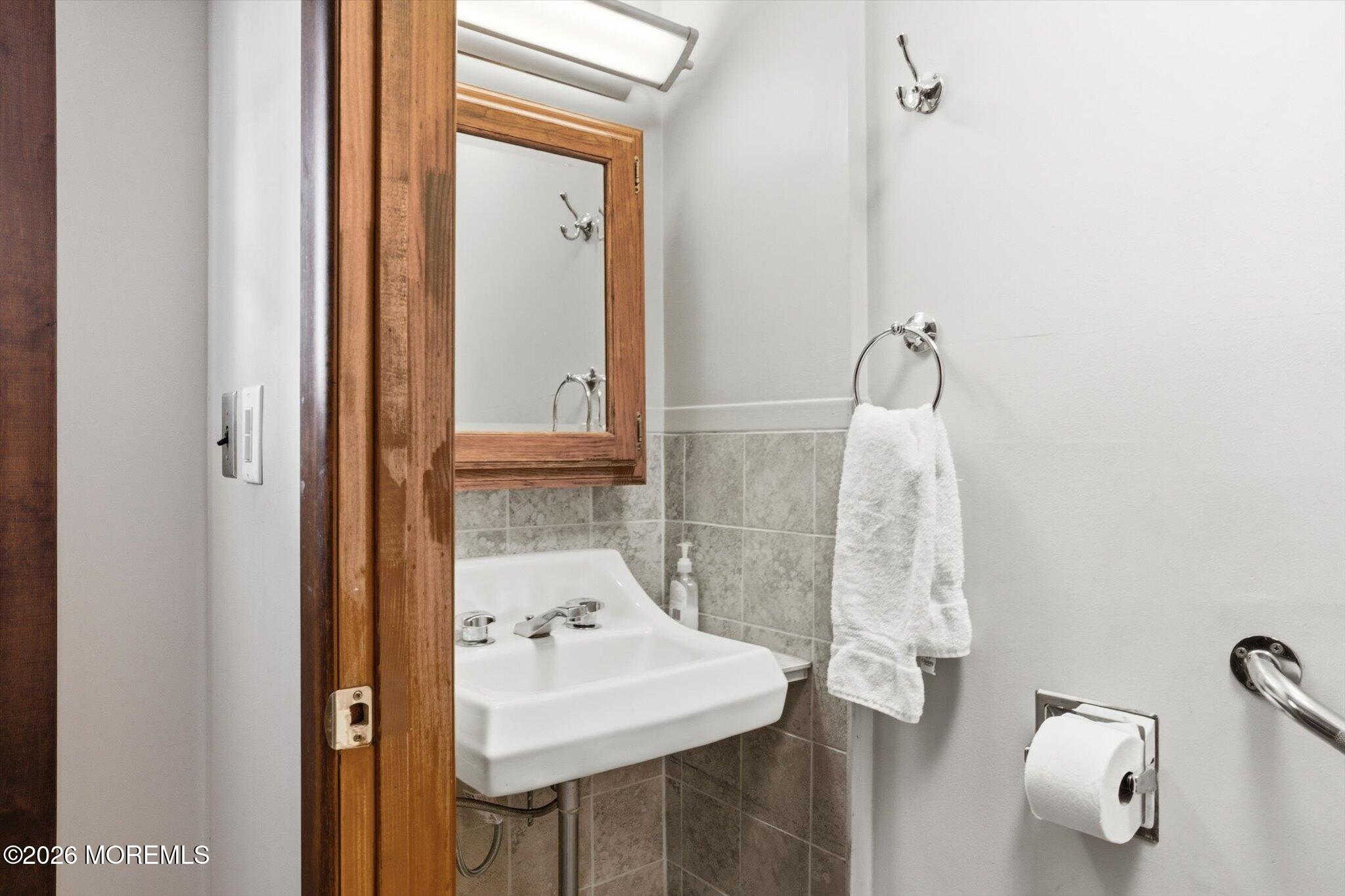 4121 Nottingham Way Hamilton, NJ 08690 - Photo 2 of 24 a bathroom with a sink and mirror