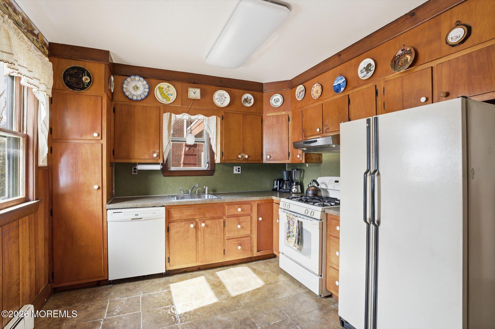 4121 Nottingham Way Hamilton, NJ 08690 - Photo 22 of 24 a kitchen with stainless steel appliances granite countertop a refrigerator and a stove