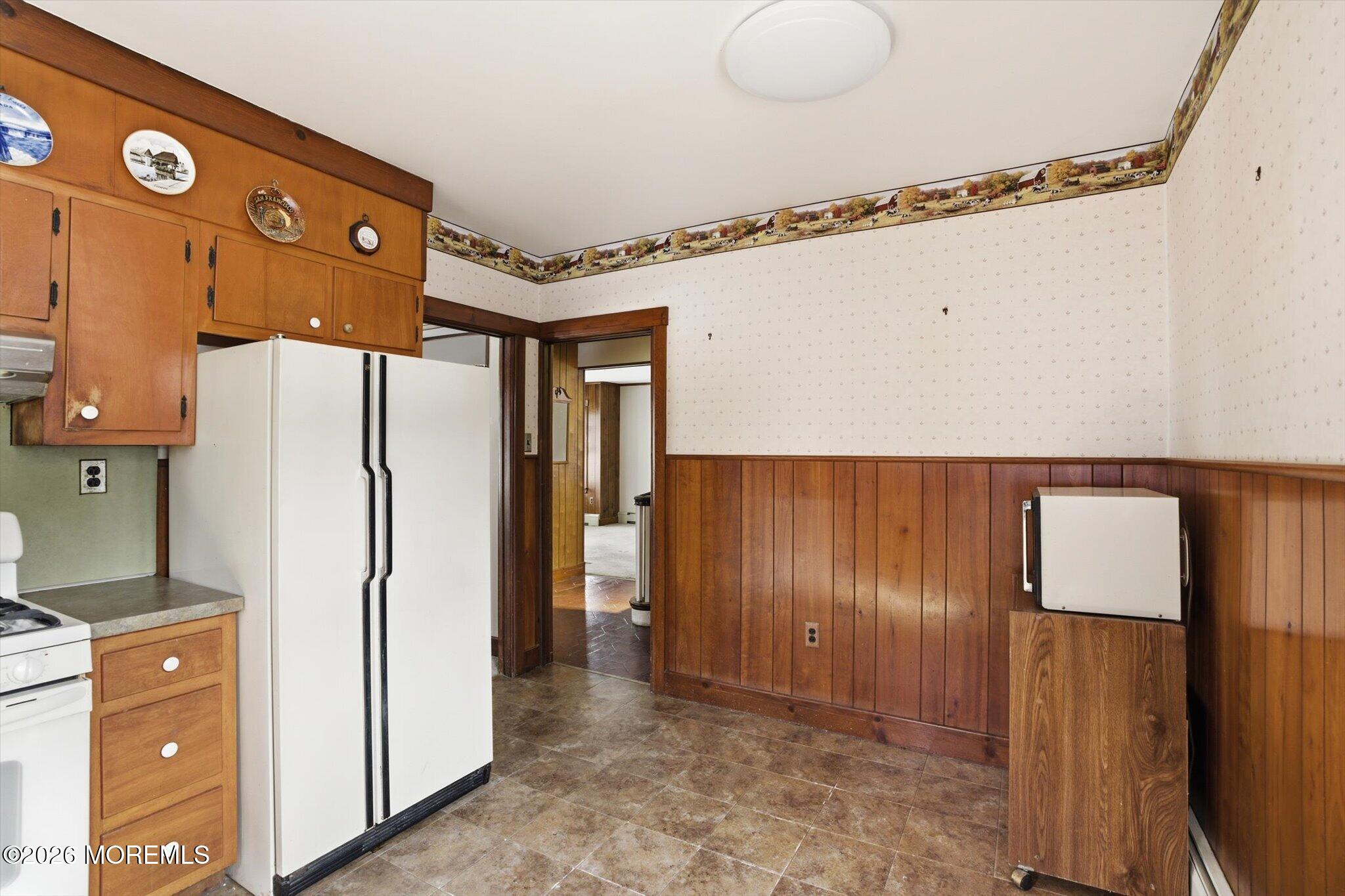 4121 Nottingham Way Hamilton, NJ 08690 - Photo 23 of 24 a kitchen with stainless steel appliances a refrigerator and cabinets