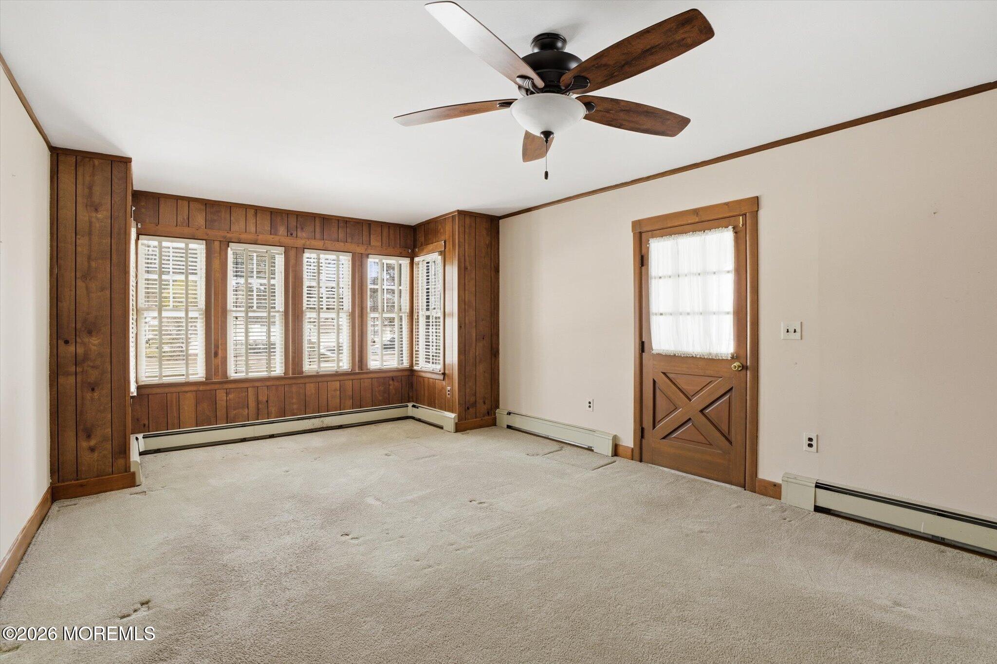 4121 Nottingham Way Hamilton, NJ 08690 - Photo 24 of 24 an empty room with chandelier fan and windows