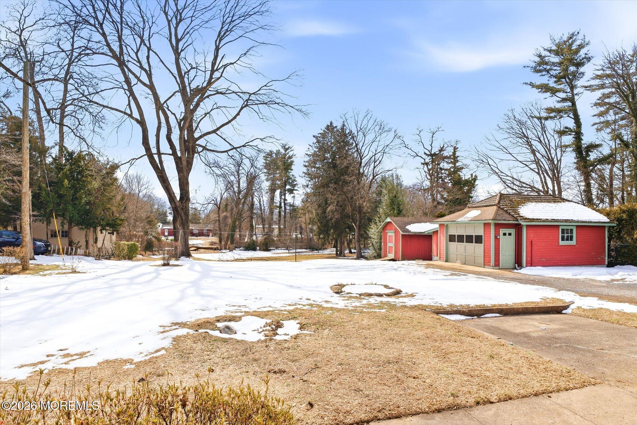 4121 Nottingham Way Hamilton, NJ 08690 - Photo 9 of 24 a view of white house with snow on the road