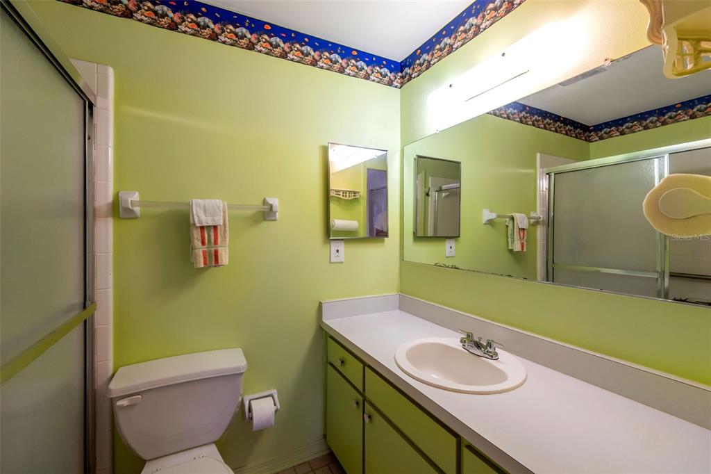1814 Fox Hunt Drive, Unit A Sun City Center, FL 33573 - Photo 11 of 23 a bathroom with a sink mirror vanity and toilet