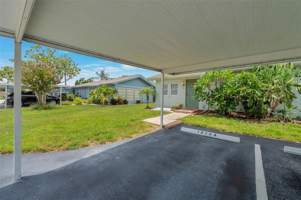 1814 Fox Hunt Drive, Unit A Sun City Center, FL 33573 - Photo 14 of 23 a view of backyard with swimming pool and green space