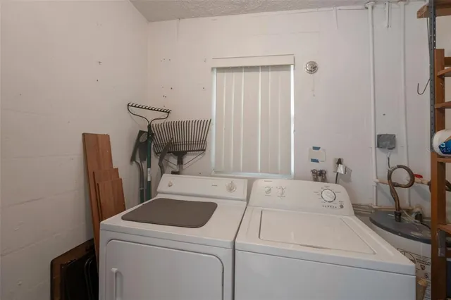 a view of storage and utility room with washer and dryer