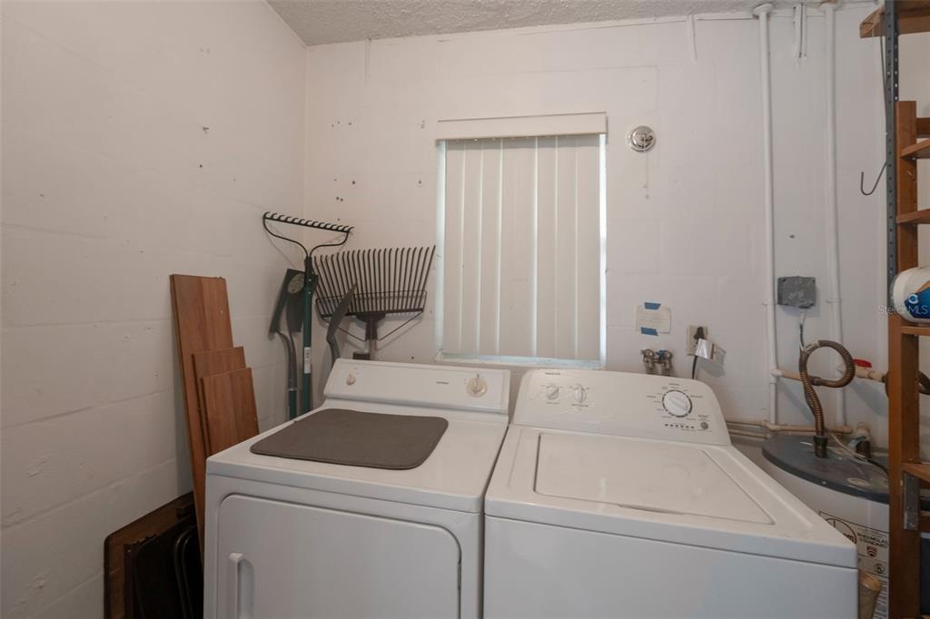1814 Fox Hunt Drive, Unit A Sun City Center, FL 33573 - Photo 15 of 23 a view of storage and utility room with washer and dryer