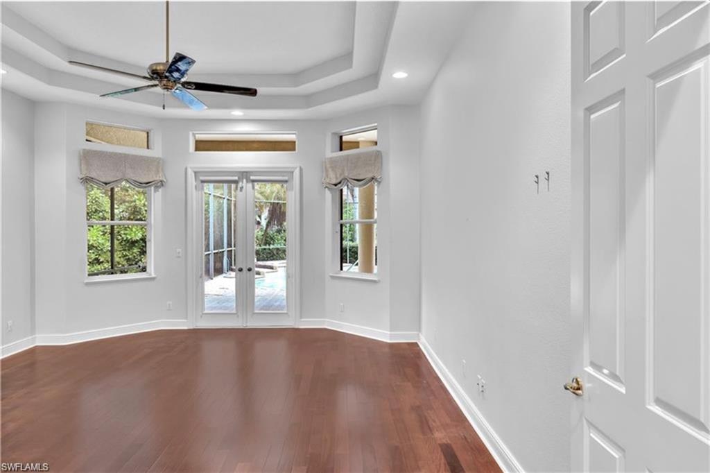 6676 Glen Arbor Way Naples, FL 34119 - Photo 13 of 23 a view of room with a ceiling fan and window