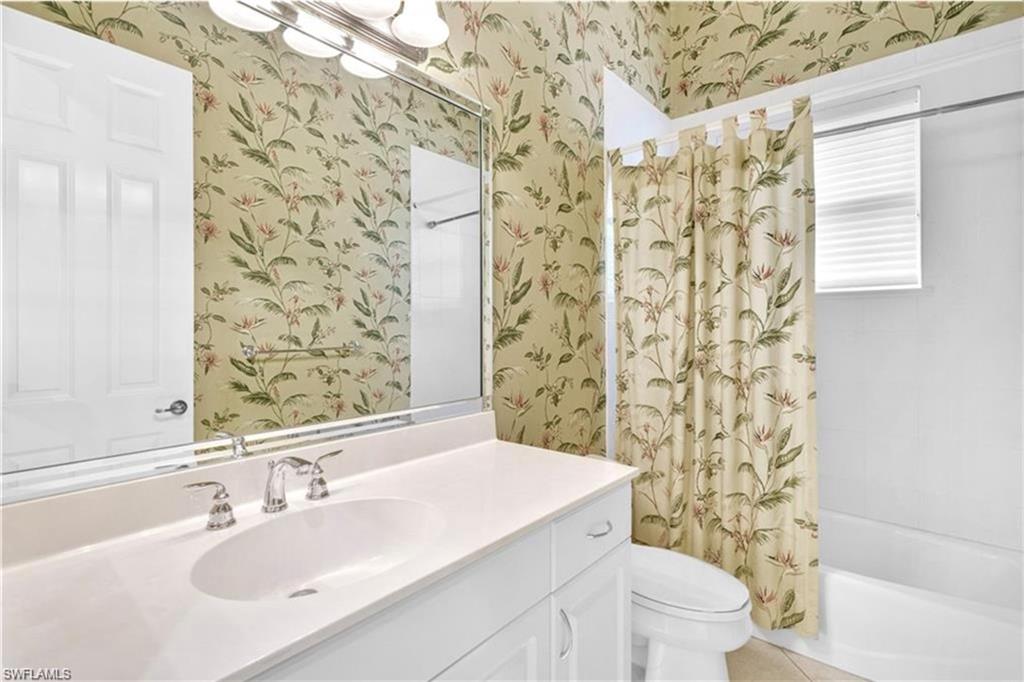 6676 Glen Arbor Way Naples, FL 34119 - Photo 18 of 23 a bathroom with a sink toilet and shower