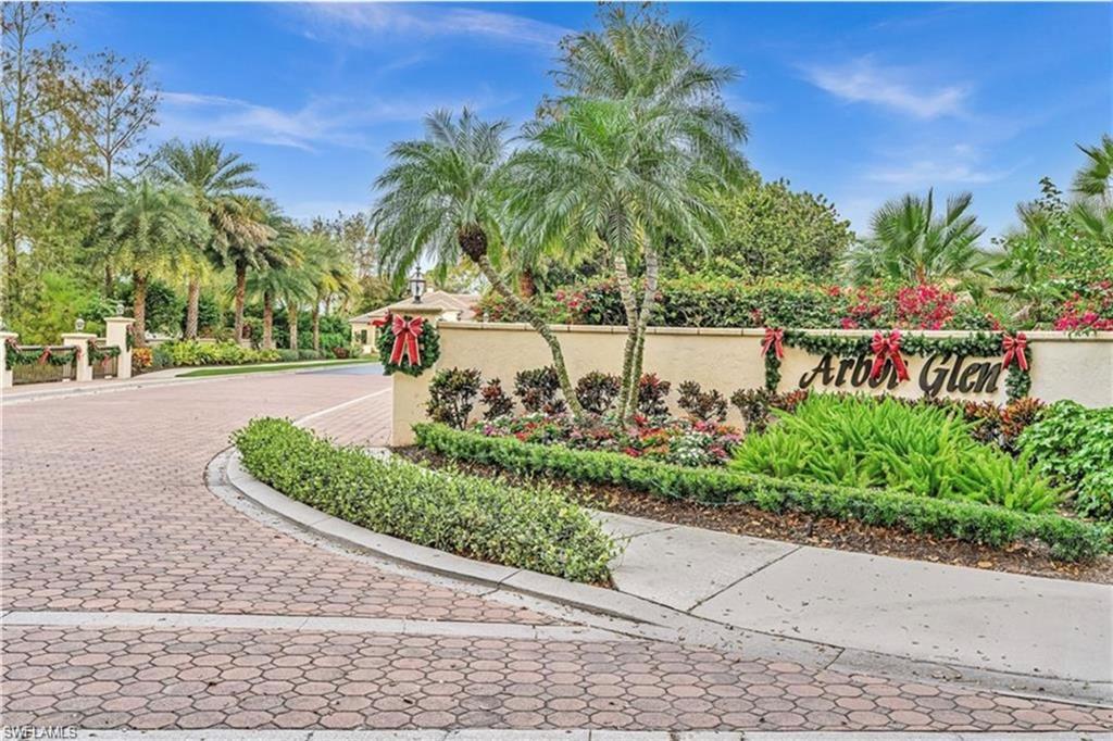 6676 Glen Arbor Way Naples, FL 34119 - Photo 23 of 23 a front view of a house with a garden