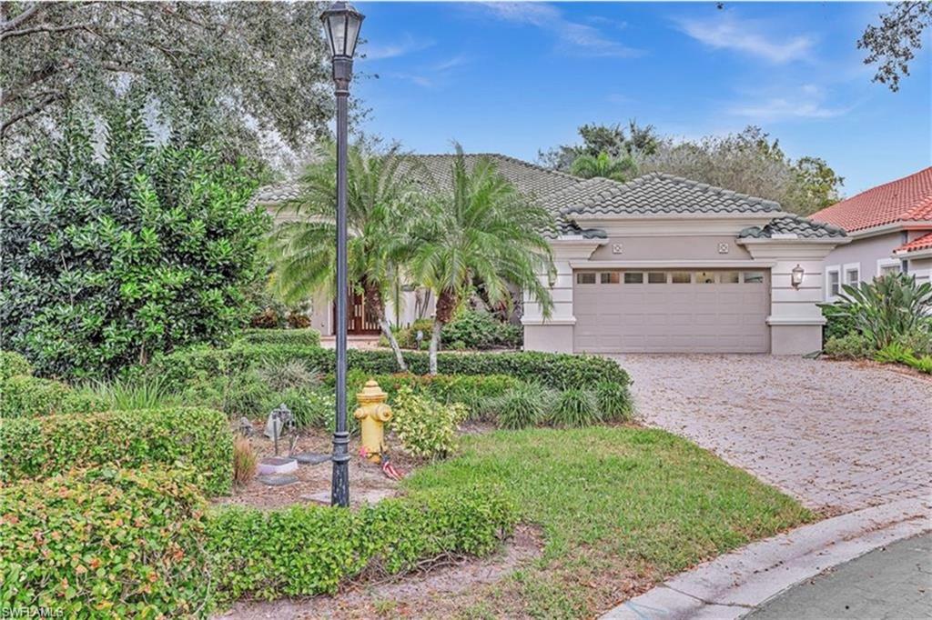 6676 Glen Arbor Way Naples, FL 34119 - Photo 3 of 23 a view of a back yard of the house