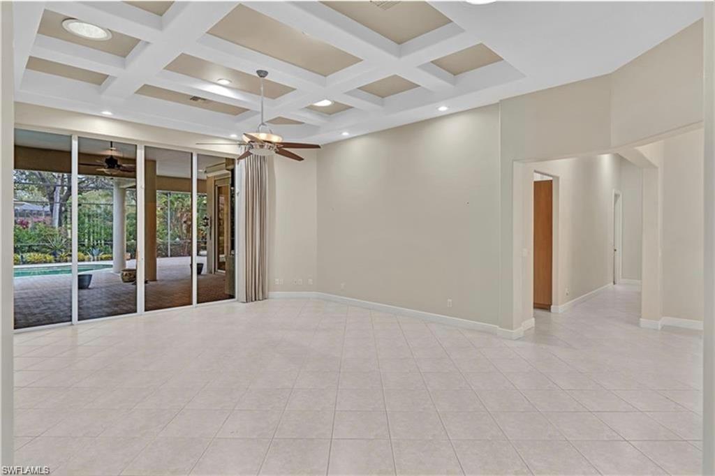 6676 Glen Arbor Way Naples, FL 34119 - Photo 6 of 23 a view of an empty room with a sliding door