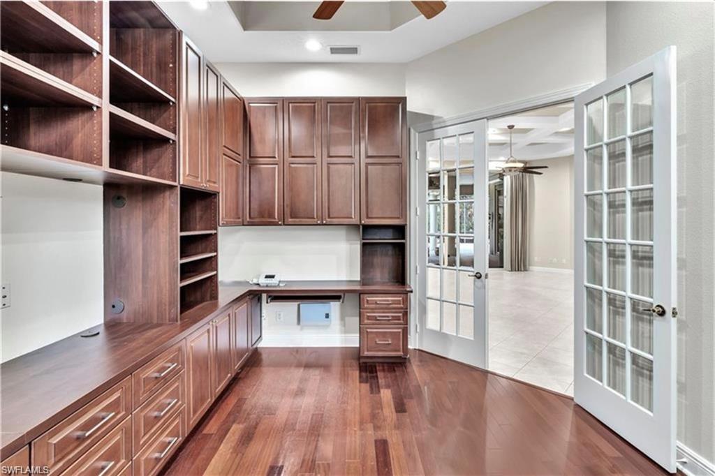 6676 Glen Arbor Way Naples, FL 34119 - Photo 8 of 23 a living room with hard wood floors and a window