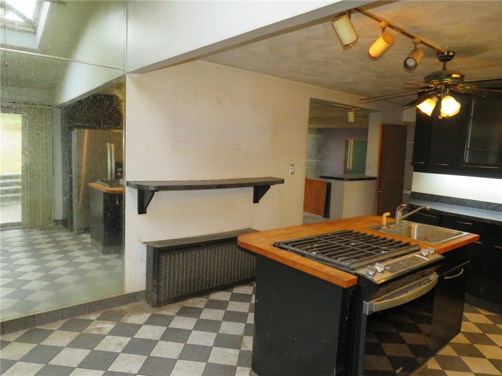 11175 Old Trail Road Irwin, PA 15642 - Photo 21 of 48 a kitchen that has a table and a stove