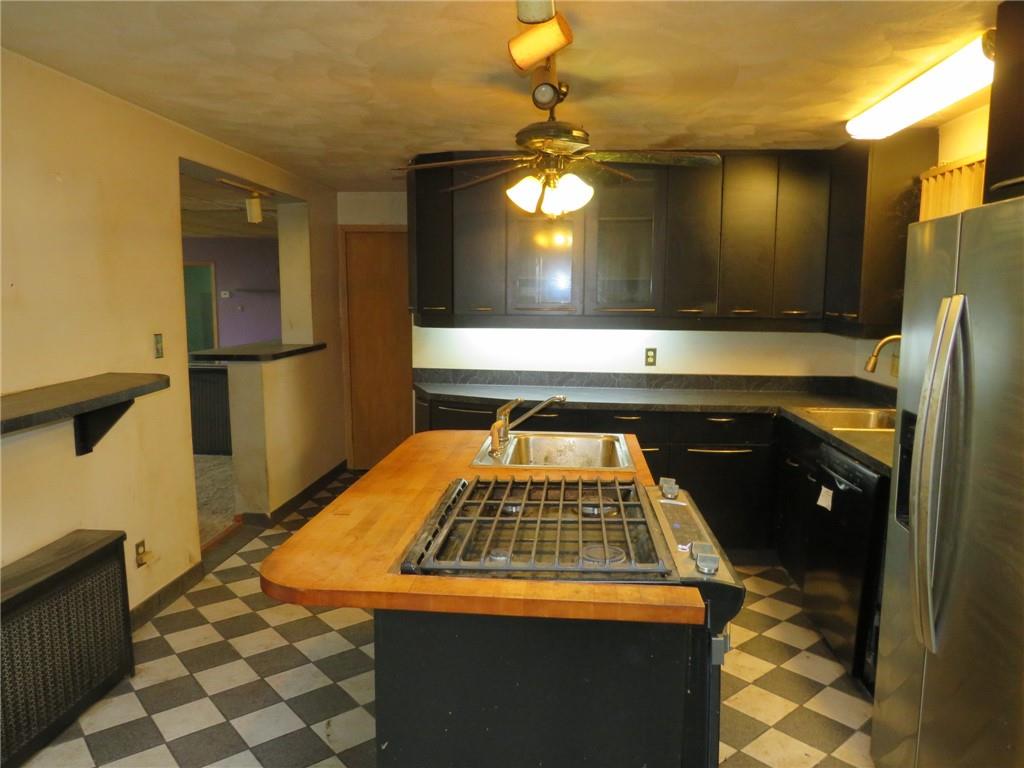 11175 Old Trail Road Irwin, PA 15642 - Photo 22 of 48 a kitchen with a stove and a refrigerator