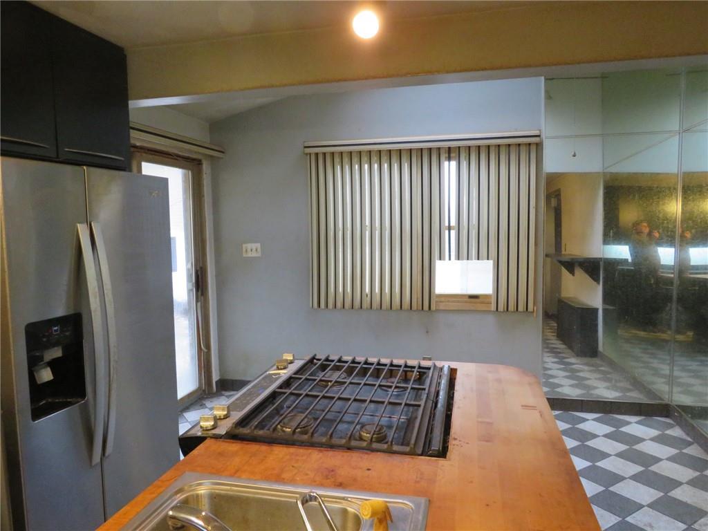 11175 Old Trail Road Irwin, PA 15642 - Photo 24 of 48 a kitchen with a refrigerator and a sink