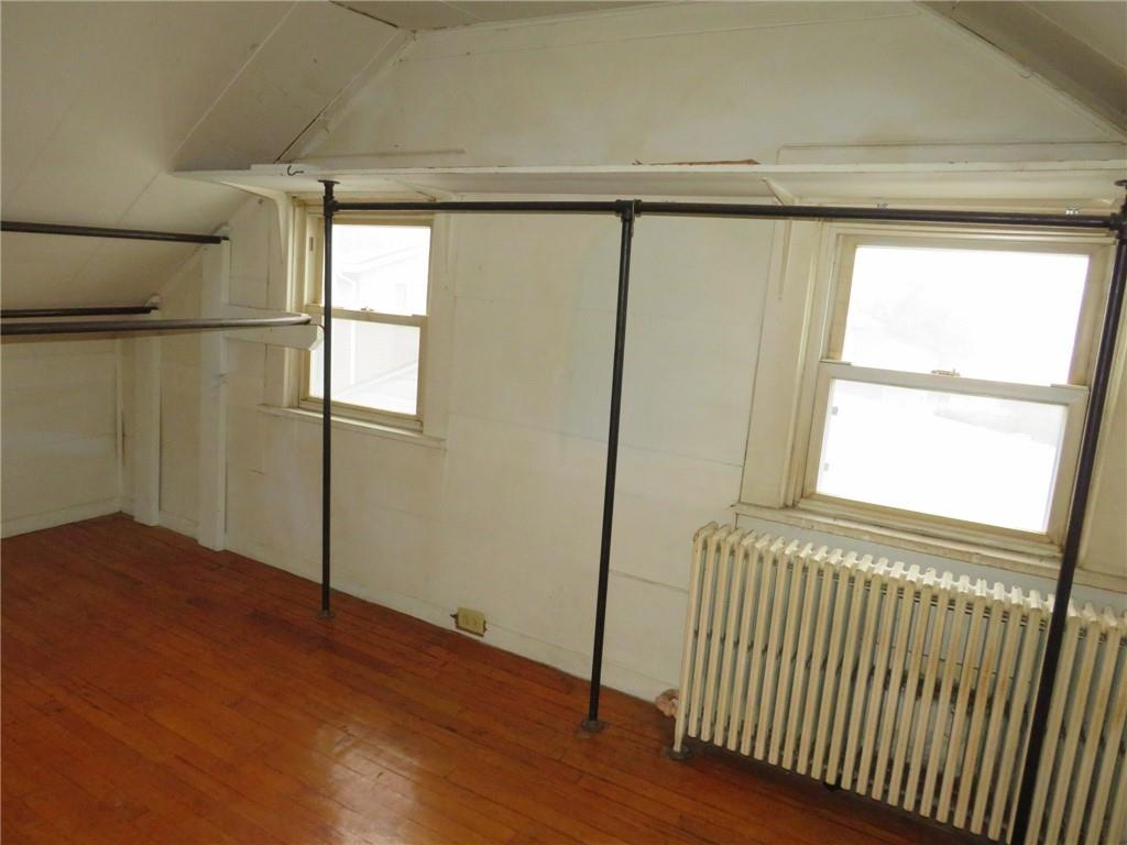 11175 Old Trail Road Irwin, PA 15642 - Photo 38 of 48 a view of an empty room with wooden floor and a window