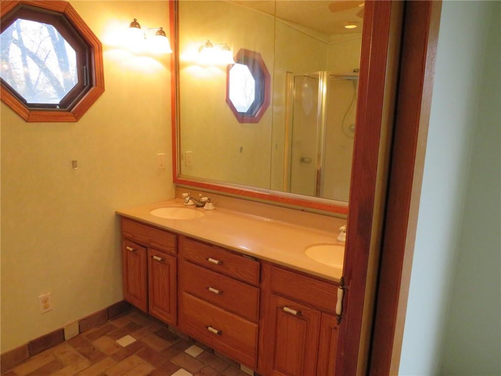 11175 Old Trail Road Irwin, PA 15642 - Photo 45 of 48 a bathroom with a sink and a mirror