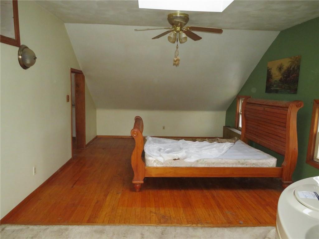 11175 Old Trail Road Irwin, PA 15642 - Photo 46 of 48 a bedroom with a bed and a chandelier