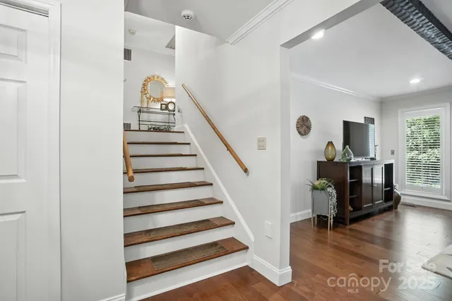 a view of entryway with wooden floor and windows