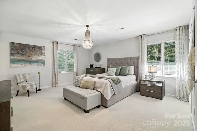 a bedroom with bed and window