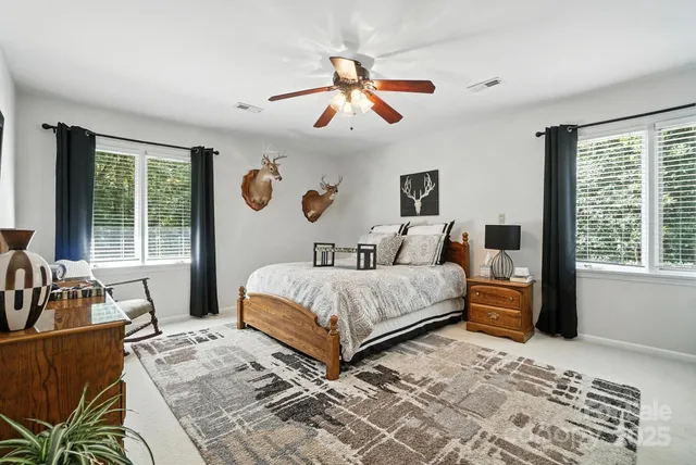 a bedroom with a large bed and a window