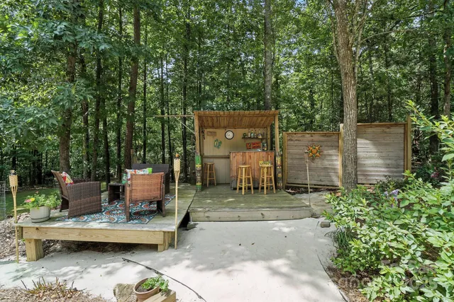 a backyard of a house with outdoor seating