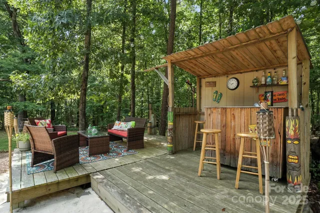 a backyard of a house with outdoor seating