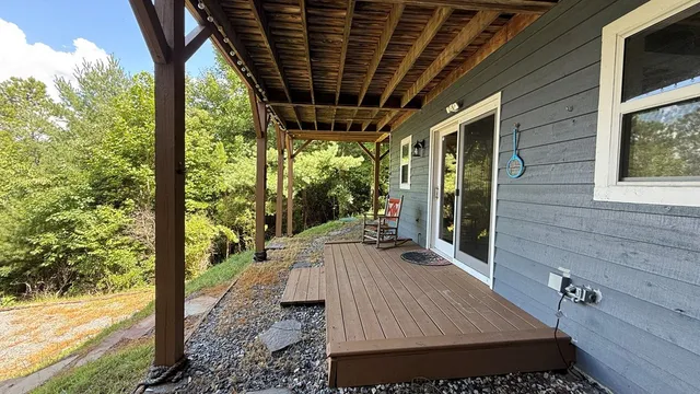 a kitchen with a sink and wooden floor