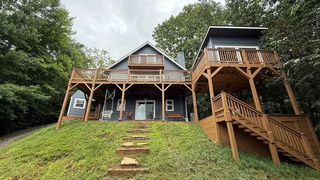 a kitchen with a refrigerator and white cabinets