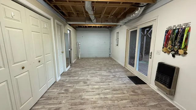 a room with a cabinets and wooden floor