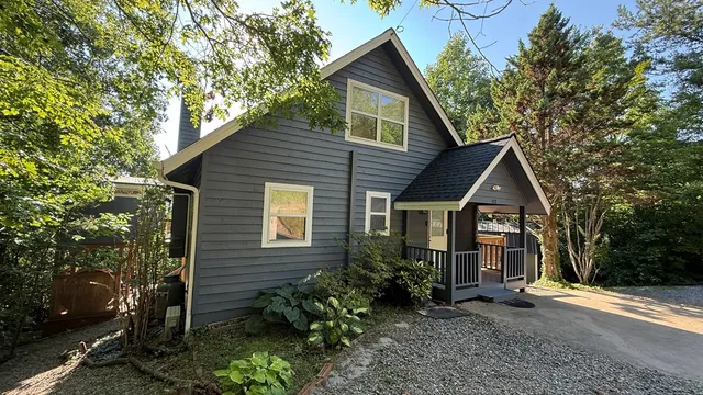 a view of hallway with wooden floor
