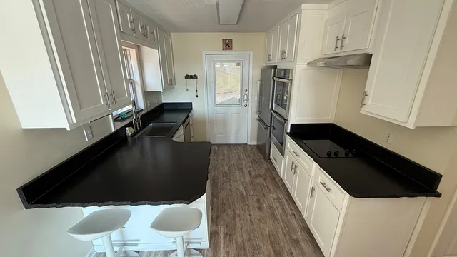 a view of swimming pool with sitting area