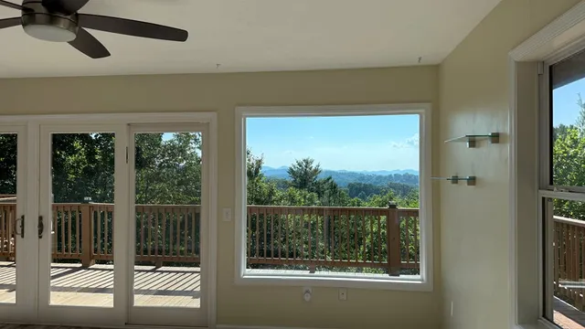 a view of a room with wooden floor and balcony