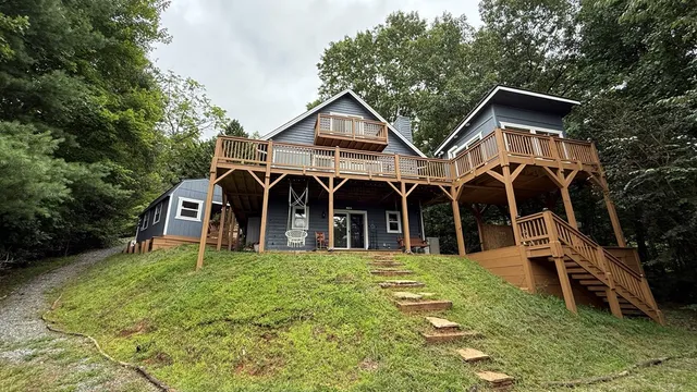 a kitchen with white cabinets and refrigerator