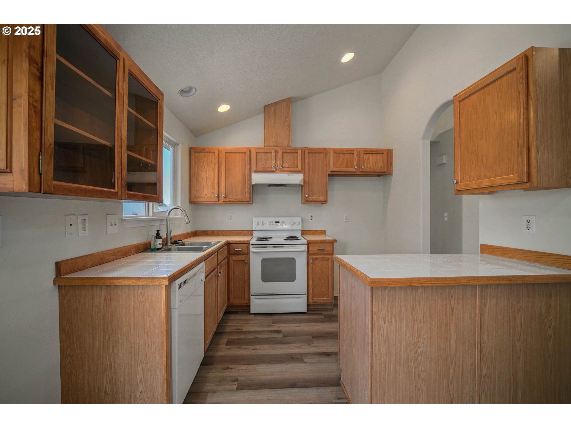 1033 E Street Independence, OR 97351 - Photo 11 of 36 a kitchen with a stove sink and cabinets