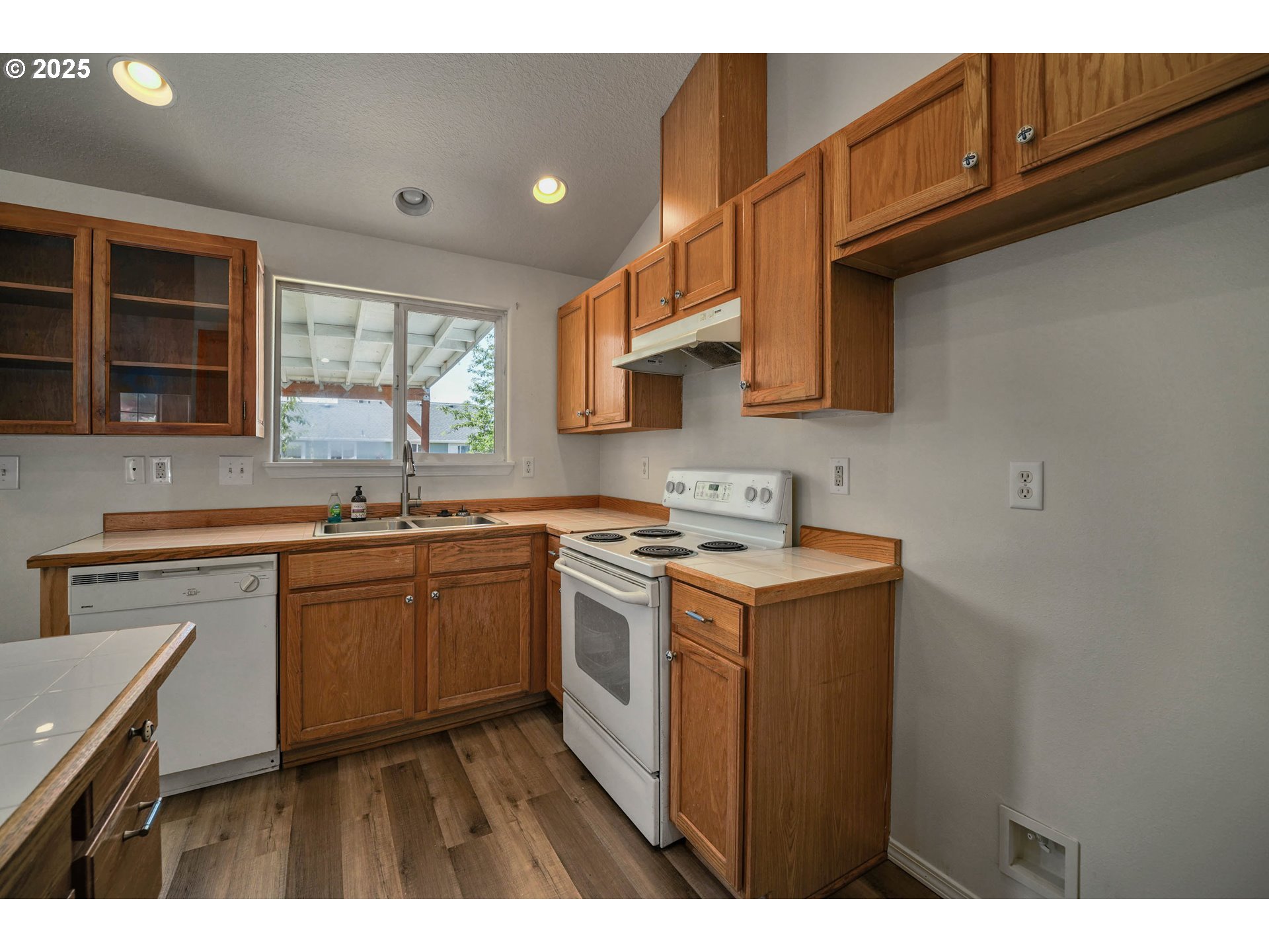 1033 E Street Independence, OR 97351 - Photo 15 of 36 a kitchen with a sink stove and cabinets