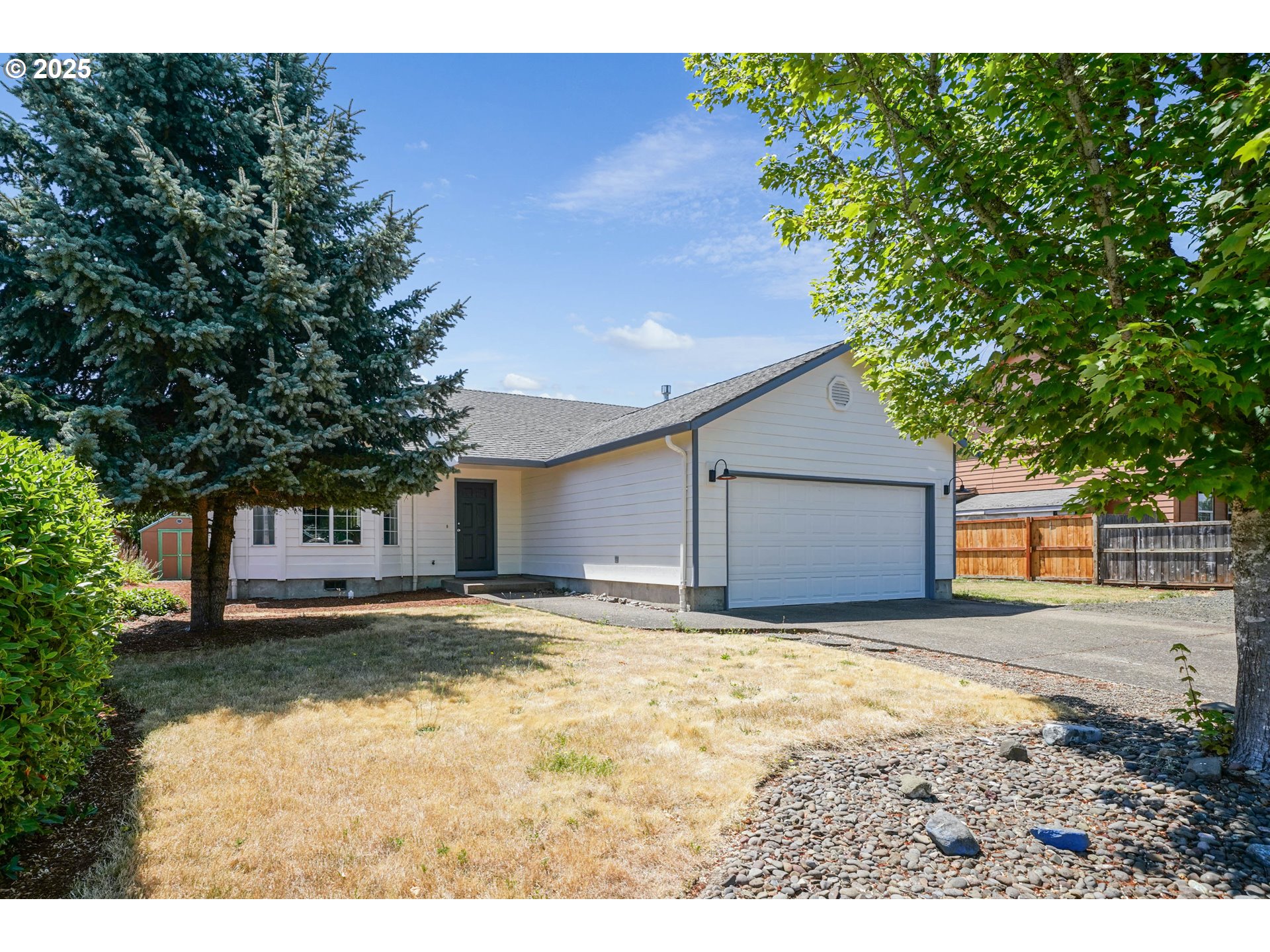 1033 E Street Independence, OR 97351 - Photo 3 of 36 a view of a house with a yard