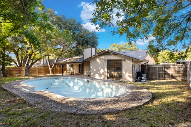 a view of a house with basketball court