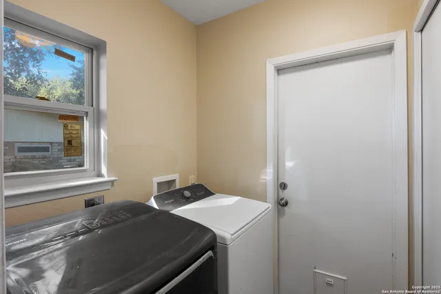 a bathroom with a sink and a window