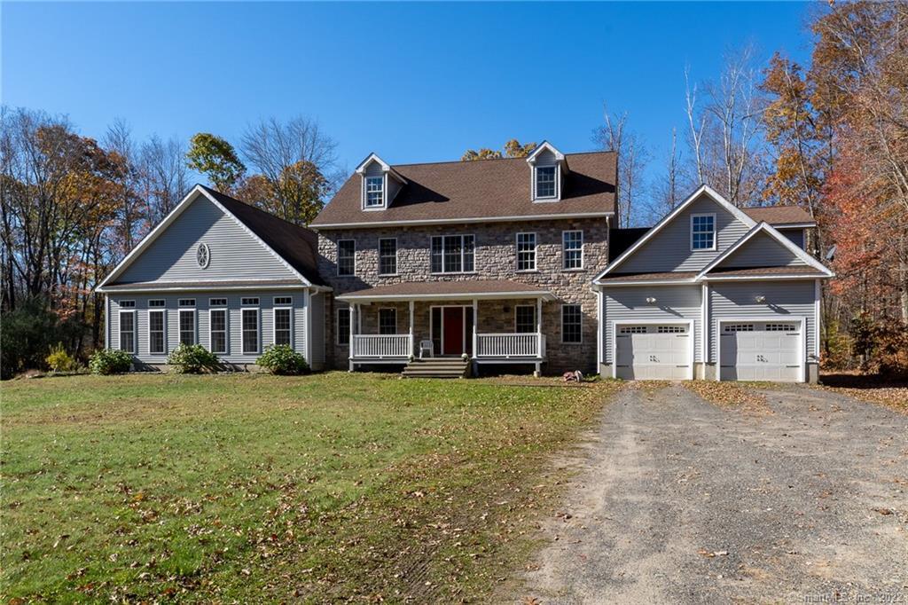 885 Pudding Hill Road Hampton, CT 06247 - Photo 1 of 1 a view of a house with a big yard and large trees