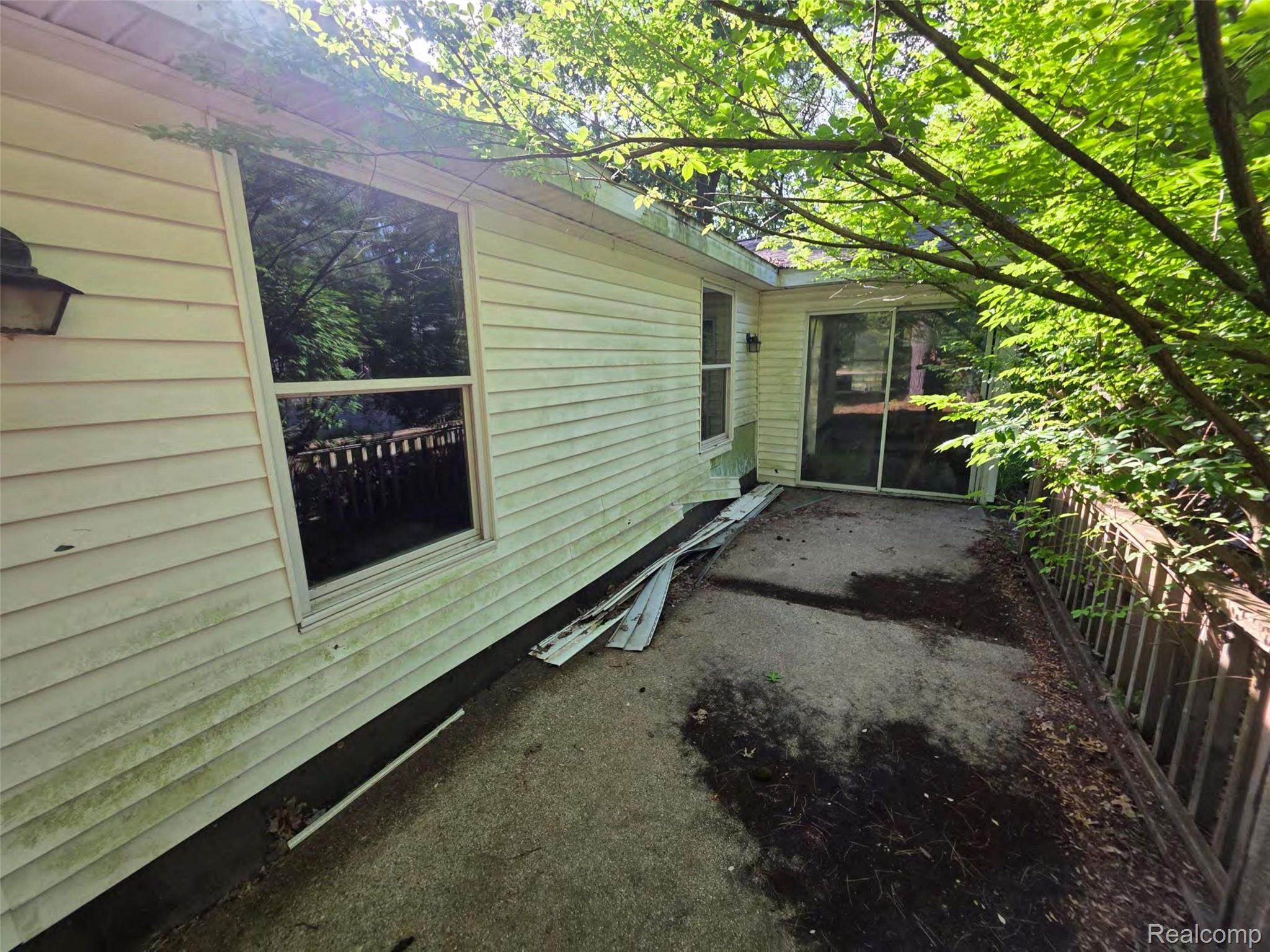 5420 Randy Drive Prescott, MI 48756 - Photo 2 of 31 Exterior deck featuring a sliding glass door and an exterior wall with horizontal siding
