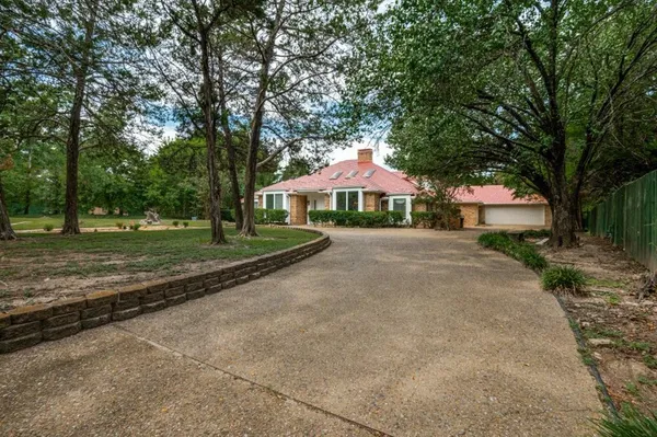 a house with trees in front of it