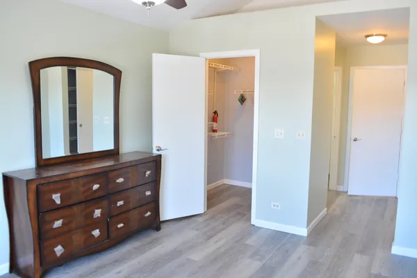 a view of room with wooden floor