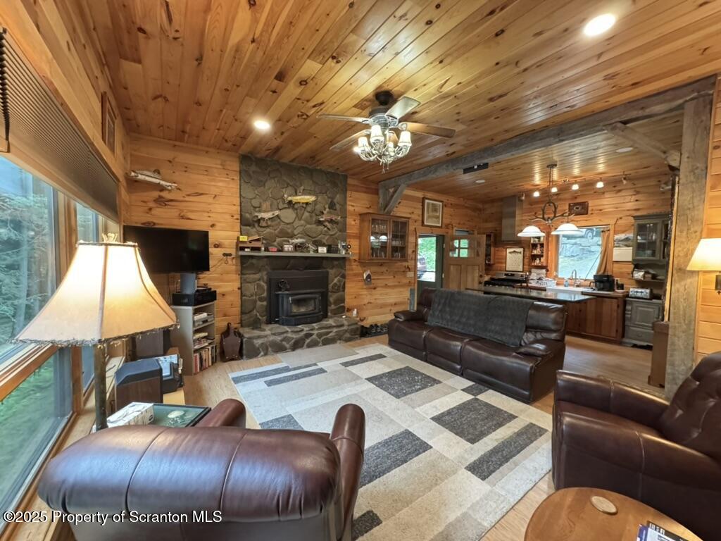 498 Penn-York Road Starlight, PA 18461 - Photo 12 of 48 a living room with furniture and a fireplace