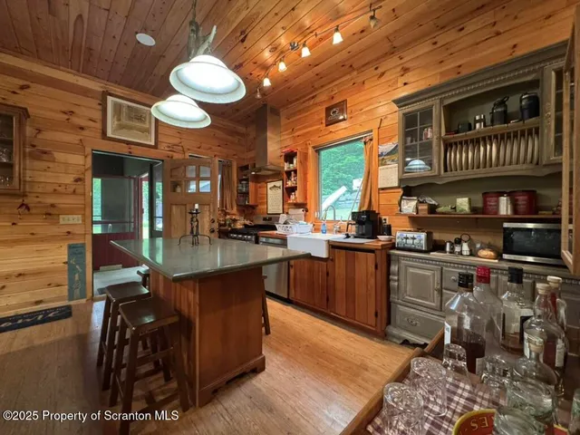 a view of a chair and tables in the balcony