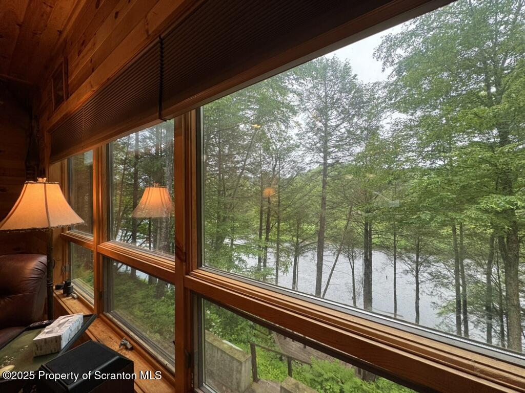 498 Penn-York Road Starlight, PA 18461 - Photo 19 of 48 a view of a chair and tables in the balcony