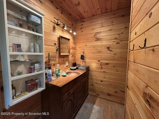 a bedroom with bed and a walk in closet