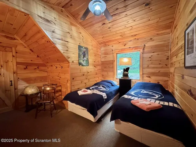 a spacious bedroom with a bed and window