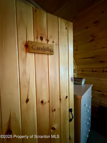 a bathroom with a granite countertop toilet a sink and a window