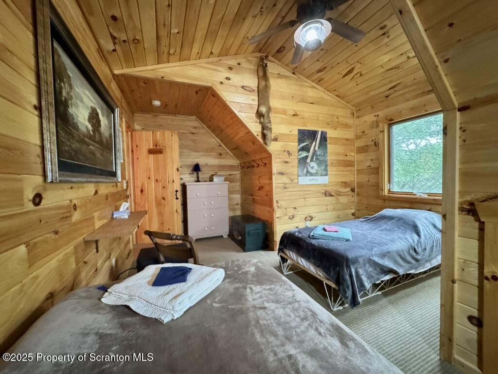 498 Penn-York Road Starlight, PA 18461 - Photo 35 of 48 a spacious bedroom with a bed and window