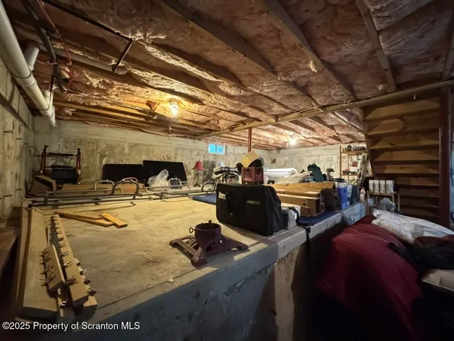 a view of a house with a yard fire pit and outdoor seating